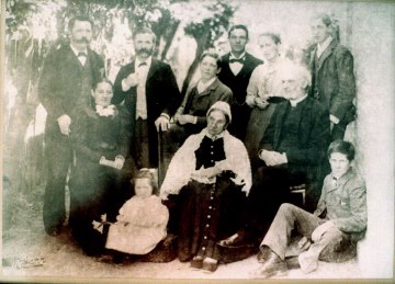 The Clark Family - taken about 1890
Seated right Godfrey John 1823-1899, seated cente his wife
Standing left Edmund, Godfrey's 3rd son, 2nd left, Stanley Godfrey's 2nd son
Seated left Holly, Edmunds wife. standind 2nd right Agnes, Stanley's wife.       
Stanley's children, Frank standing right, Lewis standing 3rd from left, 2nd son 
Percy sitting right front, 3rd son and Minnie siting front left 4th child   Edmunds      
only child Ted, standing 3rd from right, missing Godfeys 1st son Lewis and his
4th son Alfred.