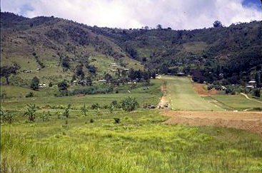 Another view of the Tapini airstrip, the crashed Caribou can 
beseen on the left just where the strip becomes visible.