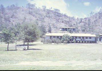 My classroom is the left half of the bottom building, 
behind it up the hill is a teachers house.